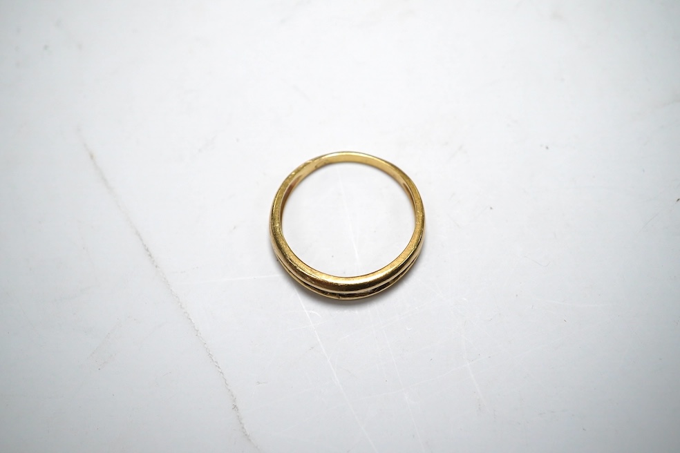 A yellow metal and channel set sapphire and diamond set half hoop ring, size Q/R, gross weight 4.2 grams. Condition - fair